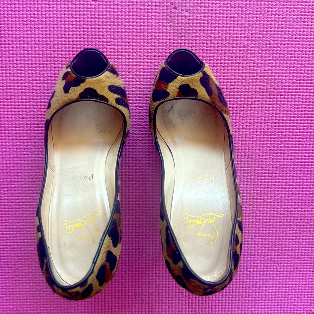 Gorgeous leopard skin (fur) peep toe high heel with 1.5 inch platform.